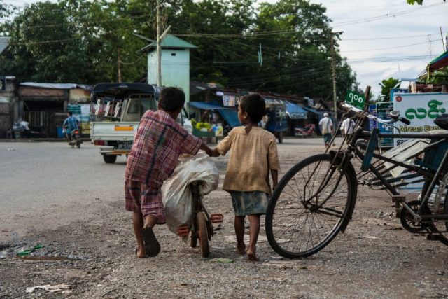 street children, child labour, dumpsite, Philippines, bicycle