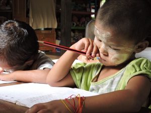 Writing a letter to a sponsored child