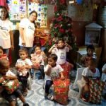 nursery children celebrating Christmas and receiving gifts in South East Asia, Inayawan