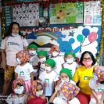 nursery children celebrating Christmas and receiving gifts in South East Asia, Inayawan