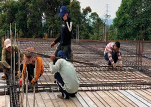 Laos students building a boarding house