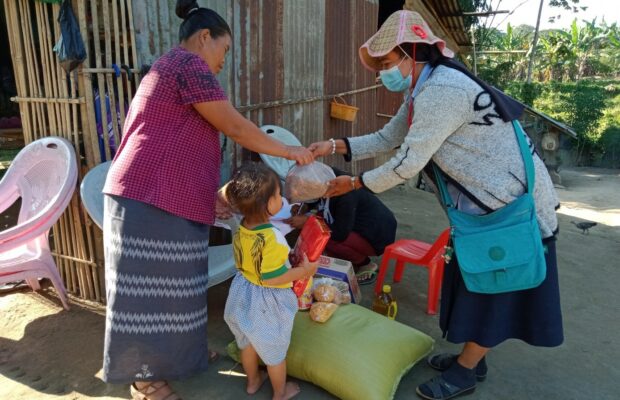 A distribution of rice and basic supplies in Myanmar (Burma)