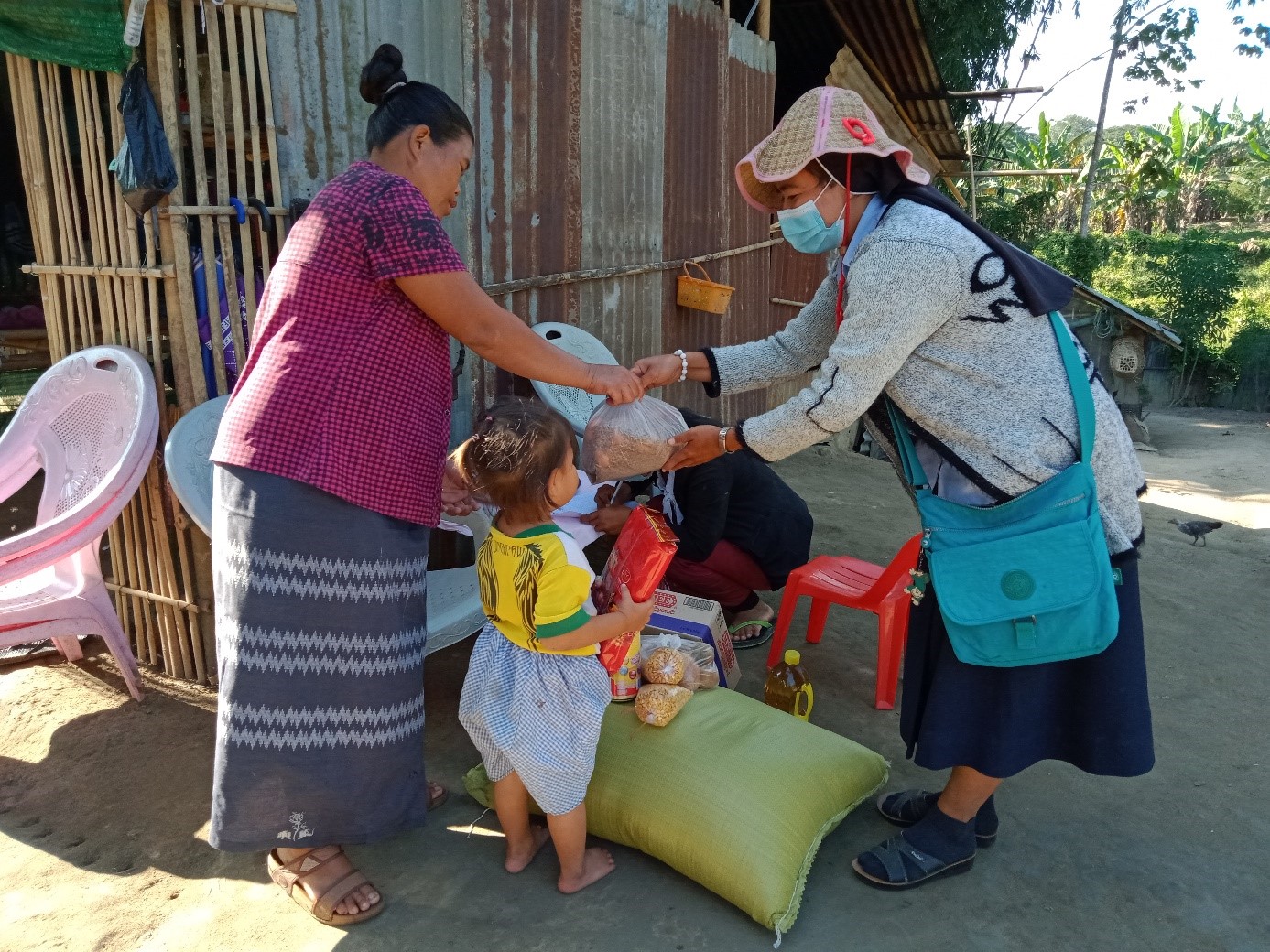 A distribution of rice and basic supplies in Myanmar (Burma)