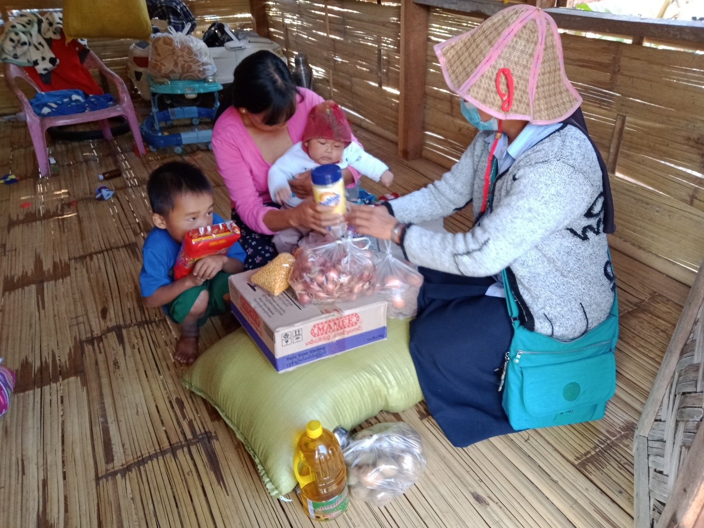 A family is being given food supply, Burma (Myanmar)