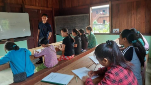 Children studying in a classroom, in Asia
