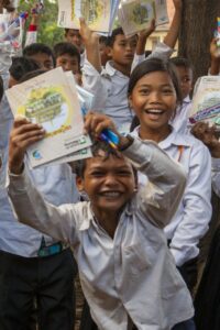 Happy students displaying their work at the Sisophon Centre, Cambodia