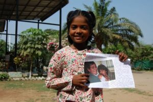Sponsored girl receive a letter
