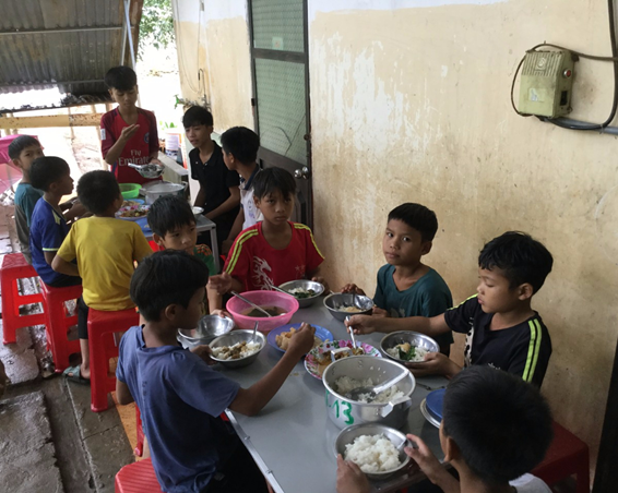Vietnamese boys having lunch