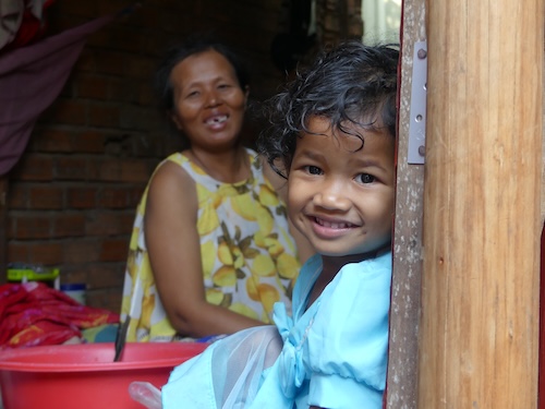 Young child with his mum at home in Cambodia